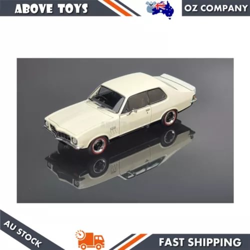 1:24 scale cream diecast model car with black wheels, side view