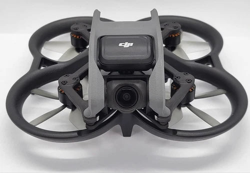 DJI drone with front camera and folded prop arms, gray and black