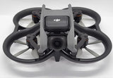 DJI drone with front camera and folded prop arms, gray and black