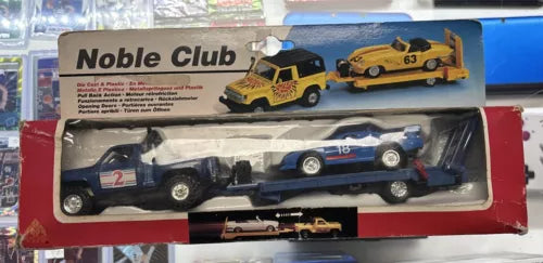 Diecast racing car set in box, showing two cars: black and silver with decals