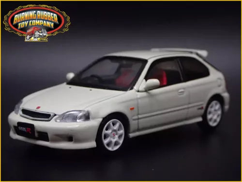 Diecast toy hatchback model car, silver with red interior, front three-quarter view