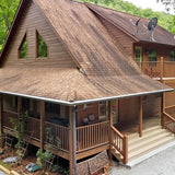 Wooden house exterior with gabled roof and covered front porch