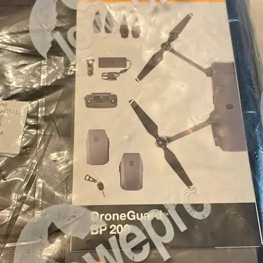 Drone backpack manual with printed diagram of drone parts and accessories