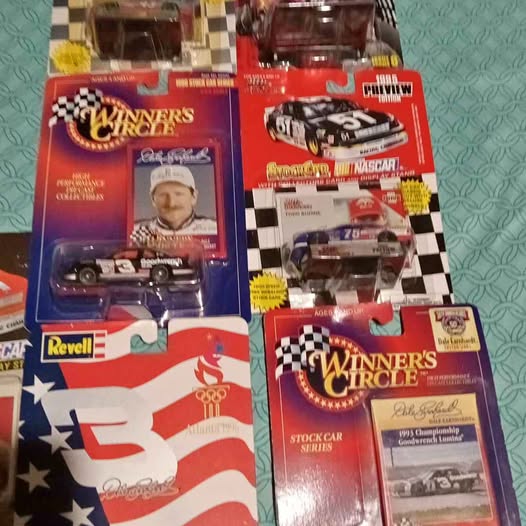 Diecast car model in Winner's Circle retail box with checkered flag design