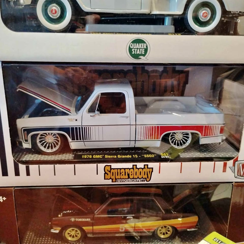 Classic white pickup diecast truck with chrome wheels, shown in display box