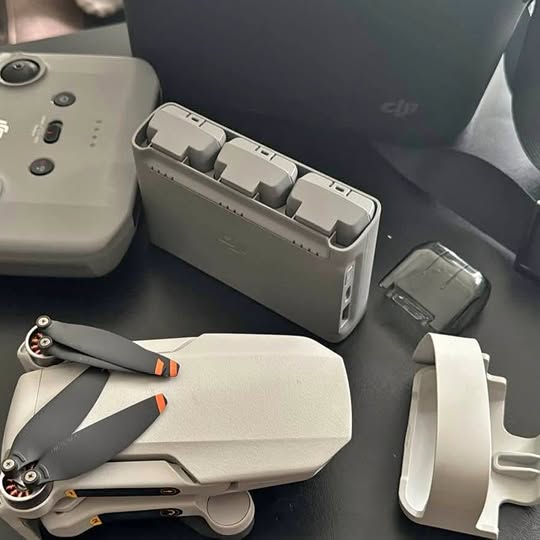 Foldable quadcopter drone with controller and charging case accessories