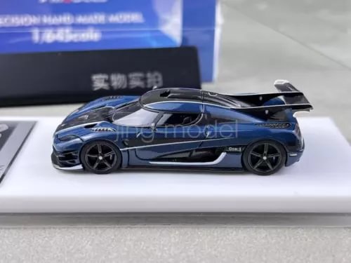 1:64 scale blue carbon racing sports model car with black wheels, side view
