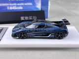 1:64 scale blue carbon racing sports model car with black wheels, side view