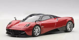 Metallic red diecast sports car model with hood scoop, front 3/4 view