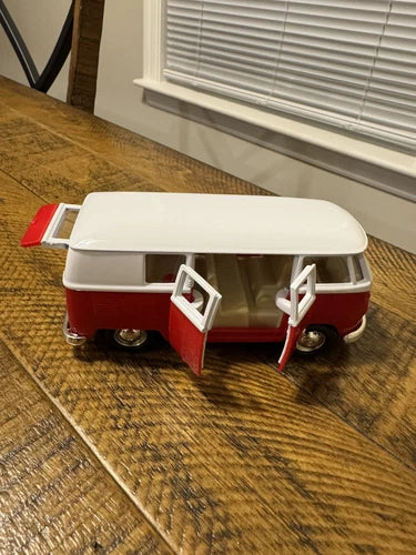Red and white VW T1 bus diecast toy car, open side door details