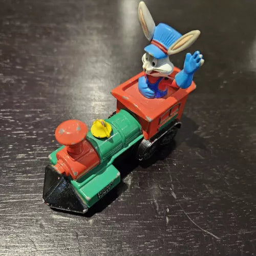 Diecast train locomotive with Bugs Bunny figure, green and red engine, black wheels