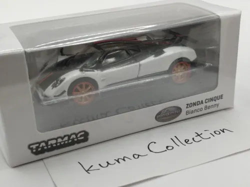 White diecast model car with red wheel accents in display box, Zonda Cinque label