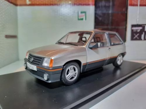 Silver 1989 diecast car model, front three-quarter view, chrome grille and black bumper