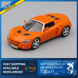 Orange 1:43 diecast sports car model with black hood vents and silver wheels