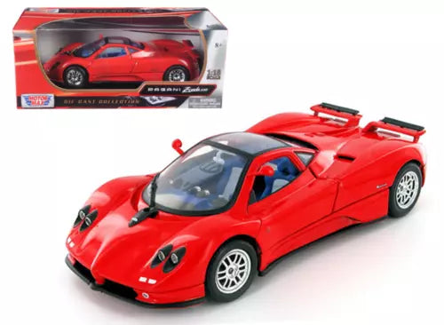 Red diecast sports car model with black aero details and white-spoke wheels