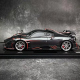1:18 diecast sports car model, black with red accents and detailed wheels