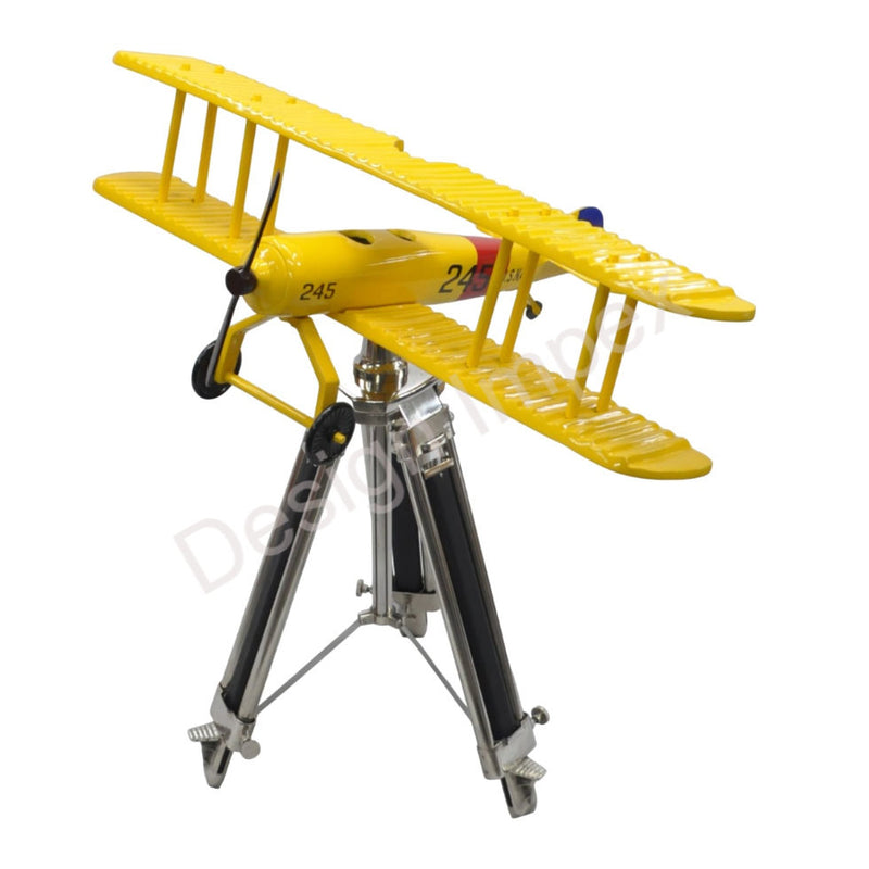 Yellow die-cast airplane model with landing gear on metal stand