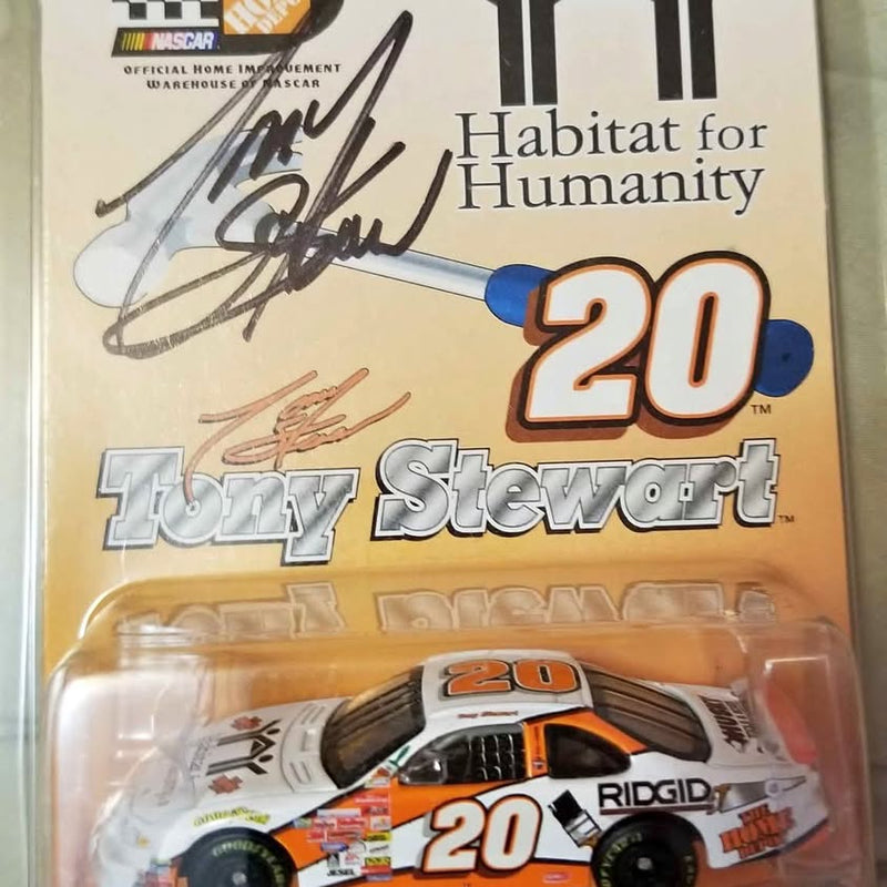NASCAR die-cast race car with Tony Stewart autograph and Habitat for Humanity 20 graphics