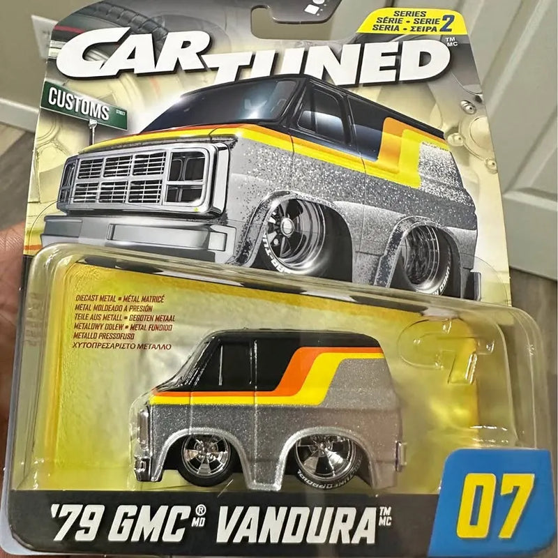 Diecast metal car model in gray with yellow and orange stripes, 07 badge