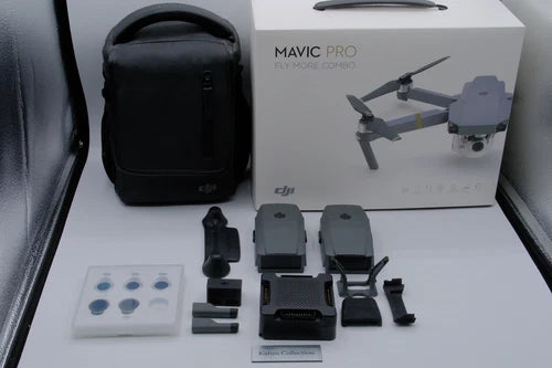 DJI drone accessories set with black carrying case, drone, and three extra batteries