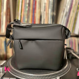 Soft travel case bag with front flap, zipper, and adjustable shoulder strap, dark gray