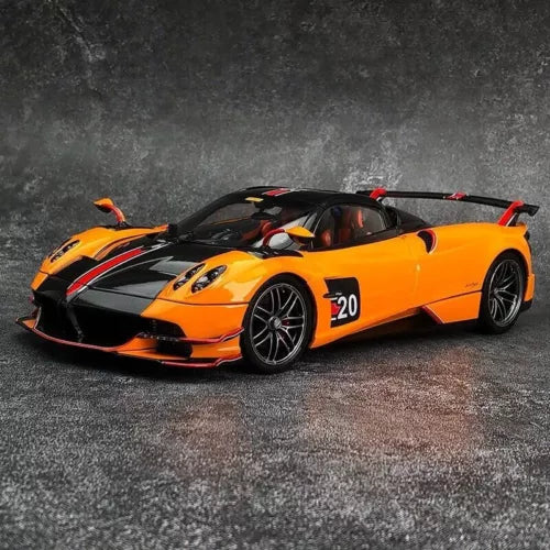 Orange diecast roadster model with black accents, number 20, open cockpit, detailed wheels