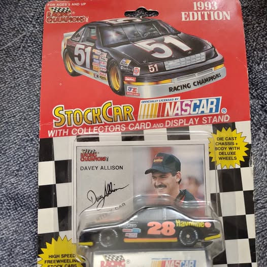Vintage diecast collectible car in box, 1993 edition with display stand and card