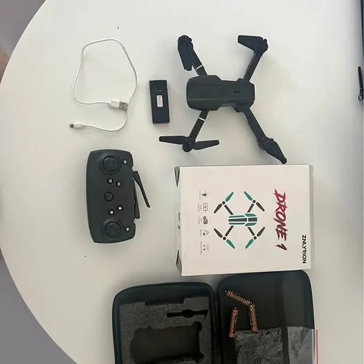 Drone and remote controller kit with charging cable and spare parts