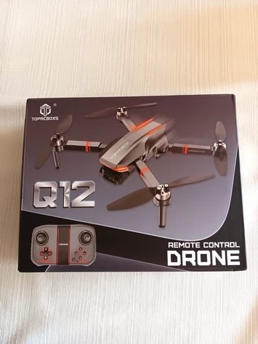Q12 remote control drone box with pictured quadcopter and controller