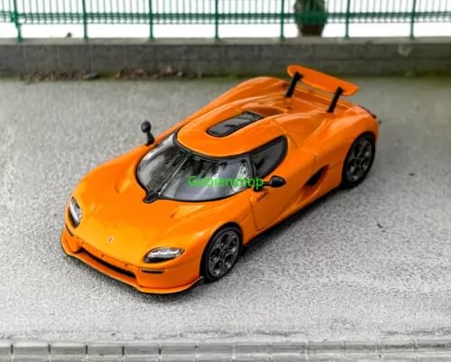 Orange 1:64 diecast super racing sports car model with black wheels and hood details