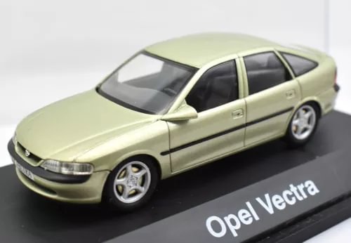 Pale yellow Opel Vectra 1:43 scale diecast sedan, front 3/4 view