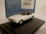 White 2-door diecast car model, front-left view on black display base