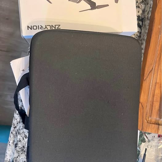 Black zippered carrying case for a drone