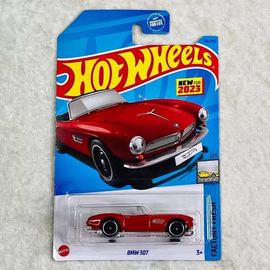 BMW 507 die-cast roadster toy car, red with black wheels, in blister pack