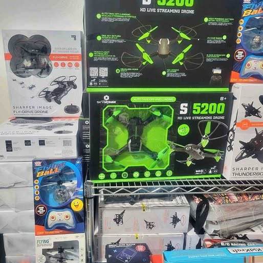 Quadcopter drone kit in retail box with green and black graphics