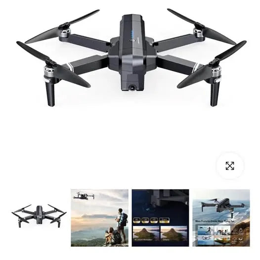 Quadcopter drone with four propellers and a central camera housing