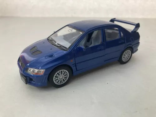 Blue die-cast toy car with rear spoiler, front-left view, detailed wheels