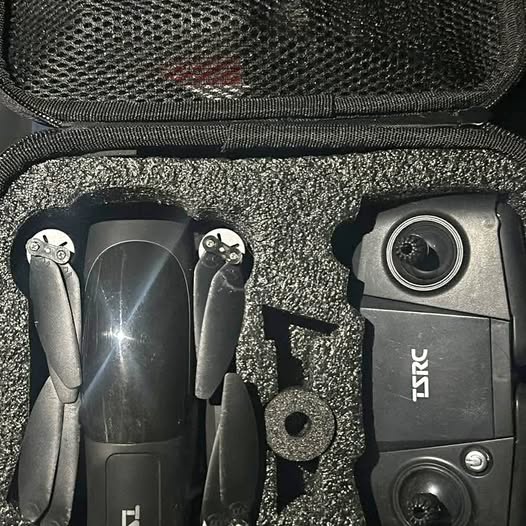 Compact drone with dual cameras in black hard-shell carrying case