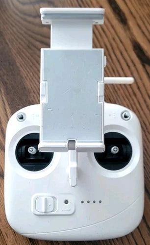 DJI Phantom 3 SE drone remote controller with white phone clamp and front buttons