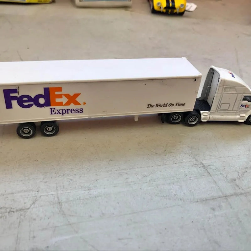 Diecast FedEx Express tractor trailer truck, white cargo box with gray cab
