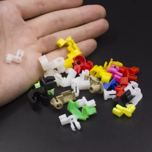 Mini toy car parts assortment in red, yellow, white, green, and black blocks