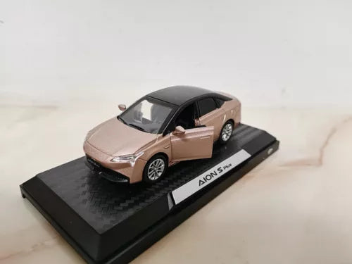Beige and black diecast model car with Aion S Plus display base