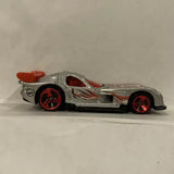 Metallic grey diecast race car with red accents and red wheels, side view.