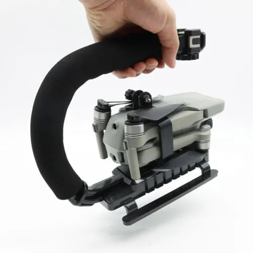 Handheld drone shooting bracket in gray and black with mount handle grip