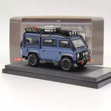 1:64 diecast Land Rover Defender van toy car, blue with roof details and front grille