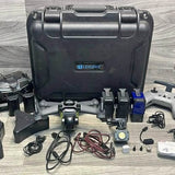 Drone accessory kit with hard transport case, controller, cables, and spare parts
