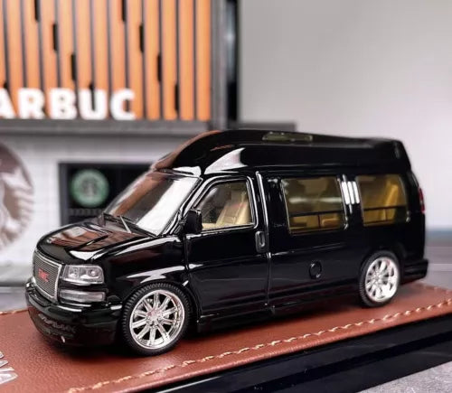 Black 1:64 diecast metal cutaway van model with detailed wheels and windows