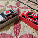 NASCAR diecast race cars: gray #5 and red #25 with sponsor decals