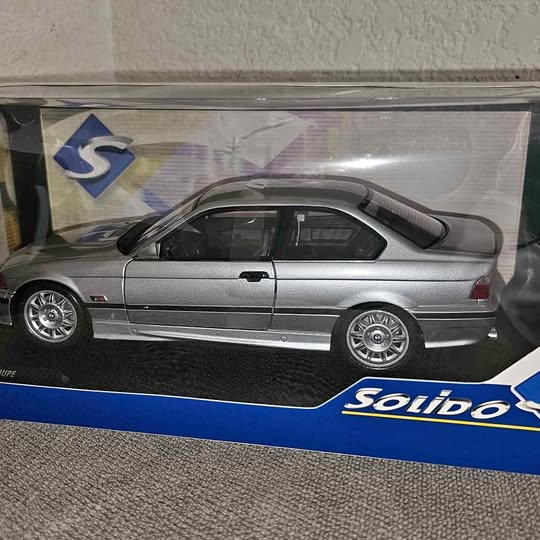 Solido diecast model car in box, silver coupe with black windows and wheels