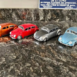 Assorted diecast Volkswagen Beetle drag bug models in red, silver, and blue, 1:24 scale